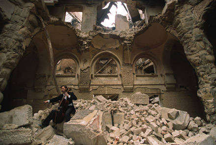Vedran Smailović plays his cello in the destroyed National Library, Sarajevo