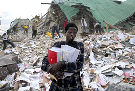 A man leaves after retrieving some documents from the rubble of a collapsed building in the aftermath of the 2010 in Port-au-Prince, Haiti. Photo: AP