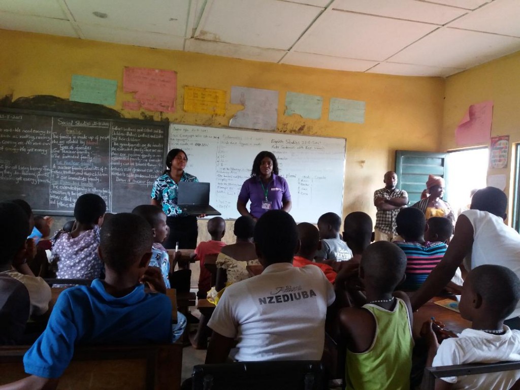 Children listening in computer class in rural Nigeria