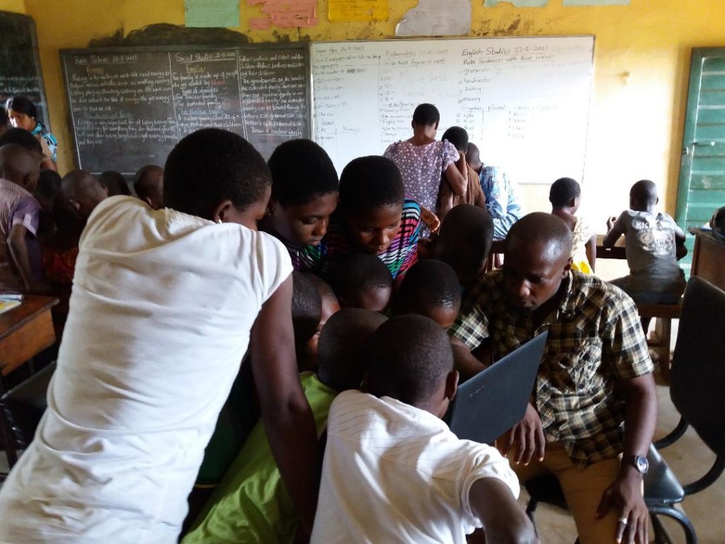 Children practicing in computer class in rural Nigeria