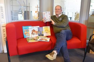 The librarian shows Saami language books at the Trøndelag County Library, Norway. 